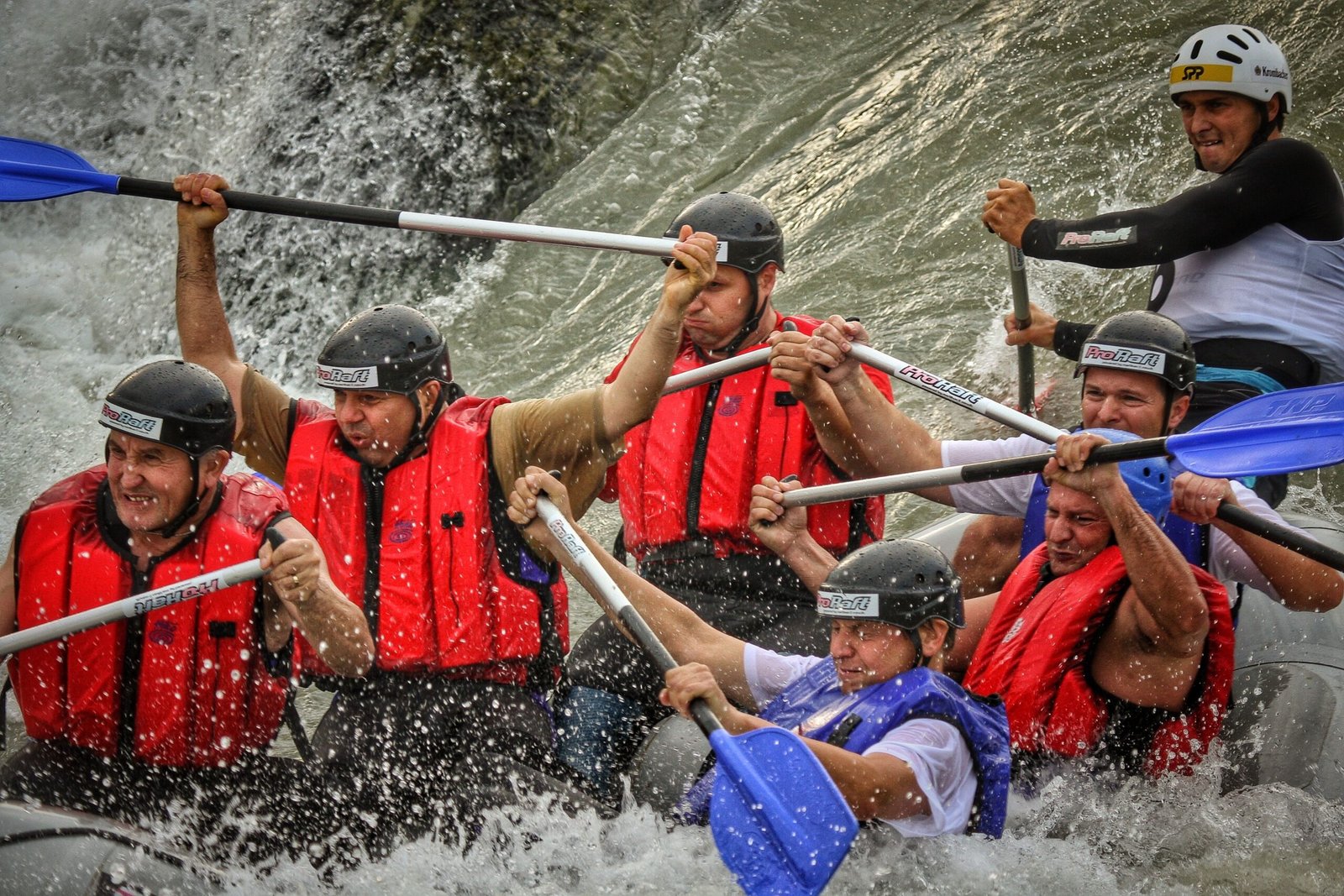 Exciting white water rafting experience on rapids with teamwork and adrenaline rush in Bratislava, Slovakia.